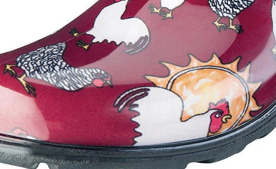 A single slip-on clog-style shoe with a glossy burgundy upper covered in a chicken and sun print, black trim around the opening, and a black sole. The brand name 'SLOGGERS' is visible on the inner side.