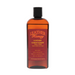 8oz Leather Honey leather conditioner bottle, showing the front label on a leather surface for nourishing and conditioning leather items.