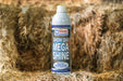 Basic Animal Health Mega Shine grooming product in a lifestyle setting, showcasing 10.69 oz bottle for farm and kennel use.