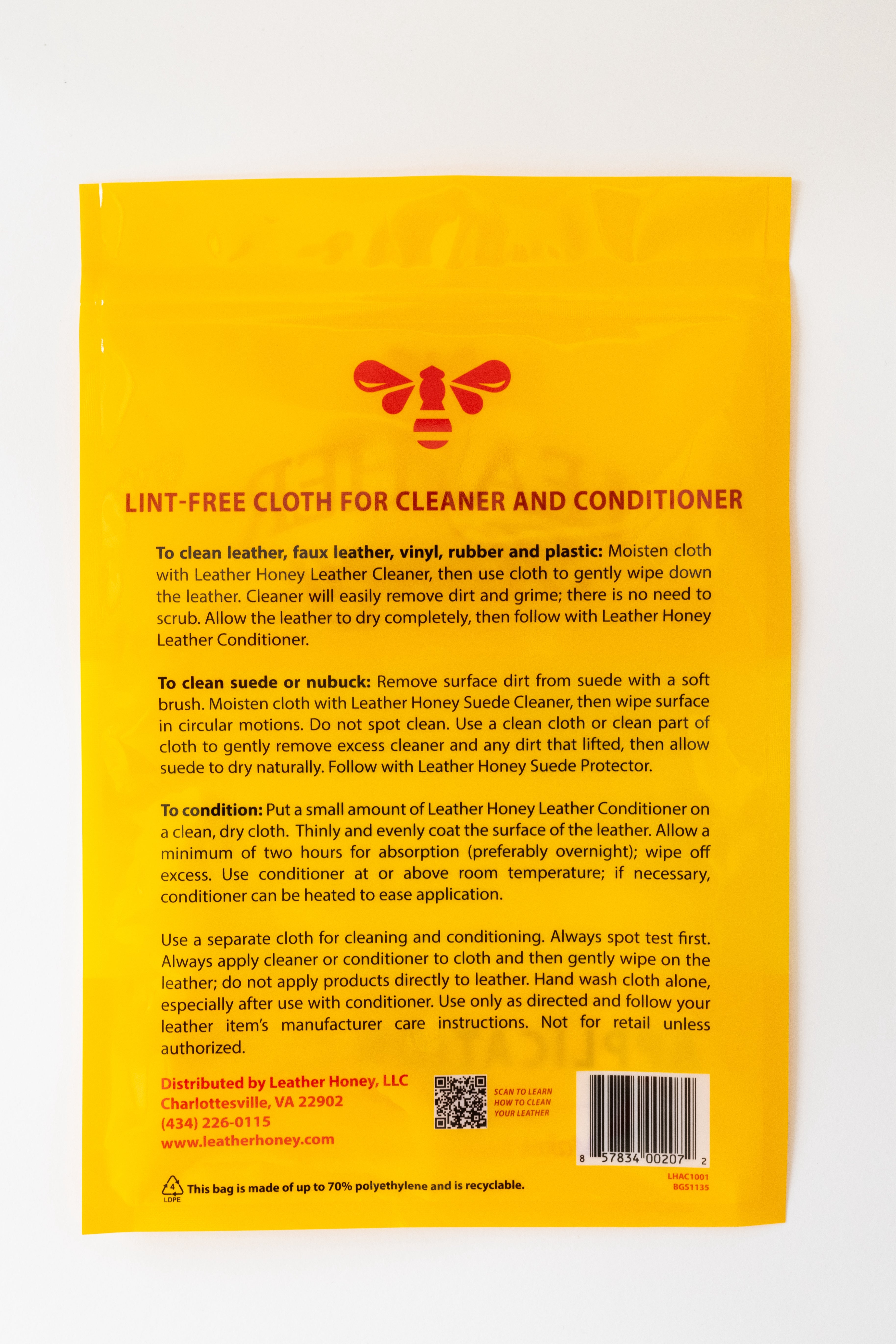 Leather Honey lint-free application cloth for leather care, shown in a new condition on a leather surface.