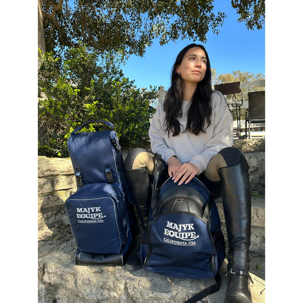 Majyk Equipe Show/Barn Bag featuring a spacious hat compartment and durable design, shown from a distance.