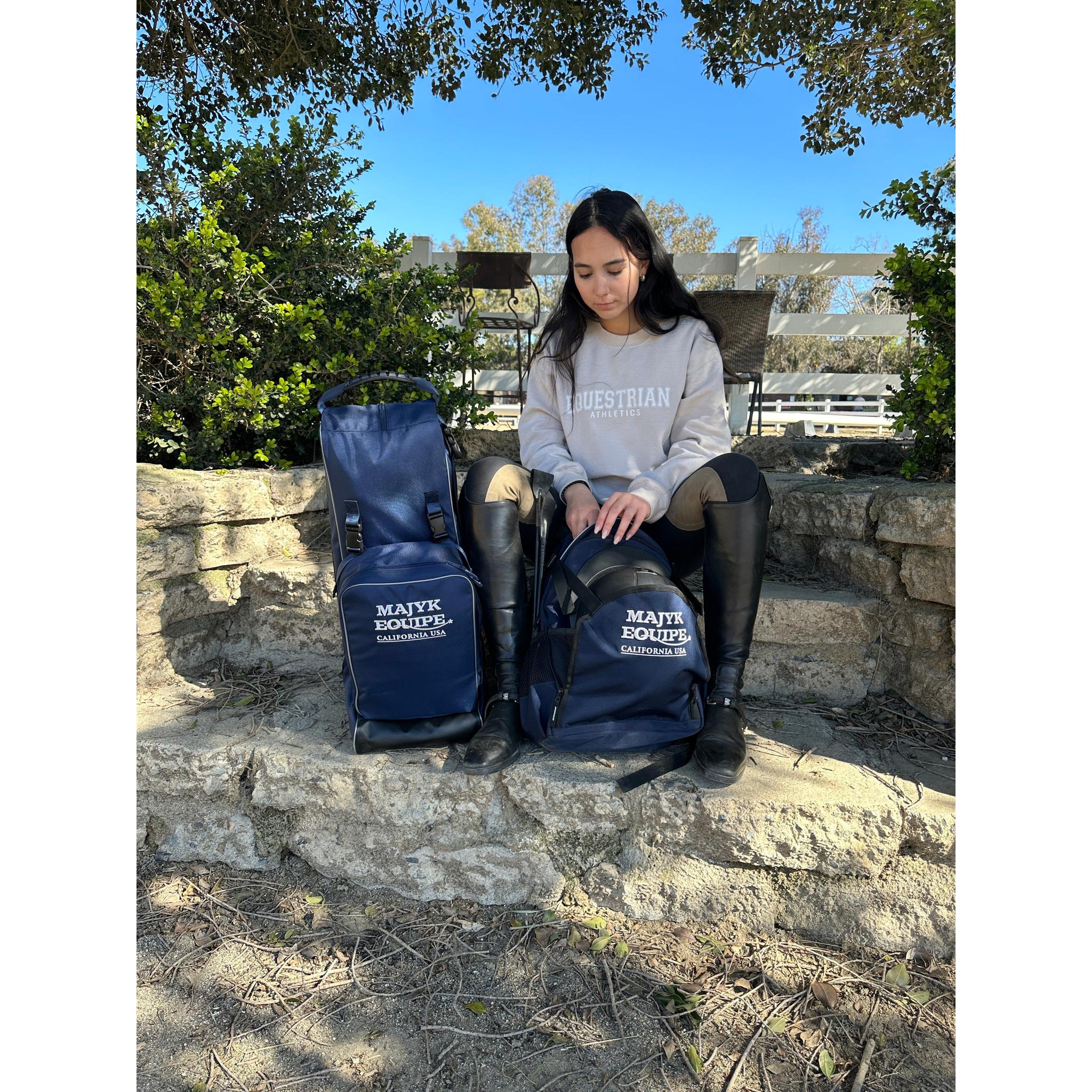 Majyk Equipe show/barn bag featuring a spacious hat compartment and multiple pockets for accessories and gear.